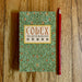 Codex The Art of Divination deluxe lift-top box with floral pattern shown beside red pencil for size comparison