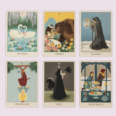 Cottage Magic Tarot cards displayed in a six-card layout featuring The Lovers, Strength, The Hermit, The Hanged One, Death, and Five of Biscuits.
