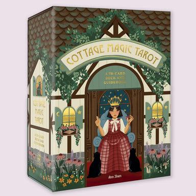 Cottage Magic Tarot box illustrated with a whimsical cottage scene and crowned figure, designed by Ann Shen