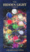 The Hidden Light Tarot card deck, 10th anniversary edition, featuring a dark blue textured cover with gold lettering and a central colorful illustration of a tree of life set against a cosmic nebula background.