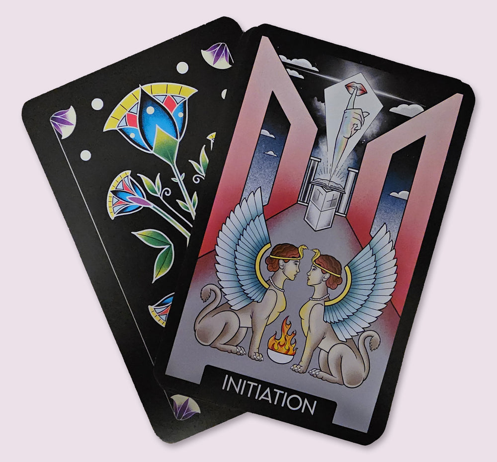 Initiation card from the Initiates Oracle showing twin sphinx guardians, sacred fire, and a mystical hand emerging from an altar