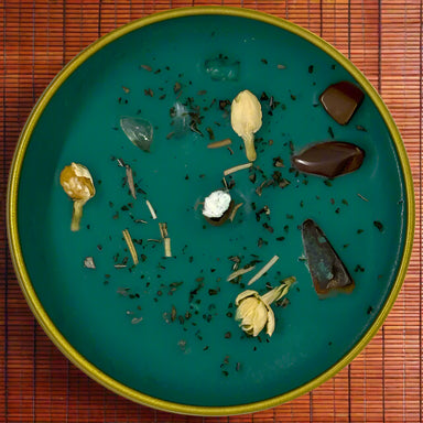 Green Candle in a gold tin with dried herbs