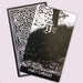 Night Visions Tarot Four of Chalices card depicting a solitary figure beneath a swirling sky in black and white artwork