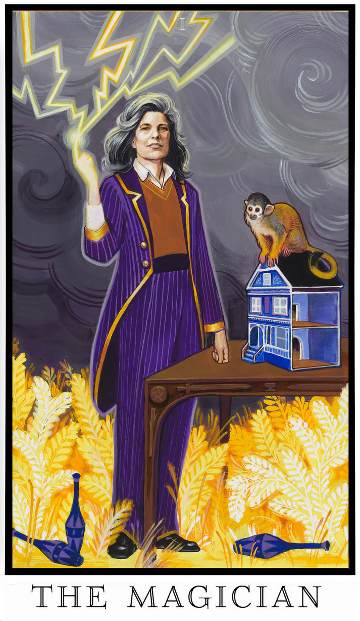The Magician tarot card from The Modern Queer Tarot depicting Susan Sontag, holding a lightning bolt beside a table of tools, representing intellect, creative power, and transformation.