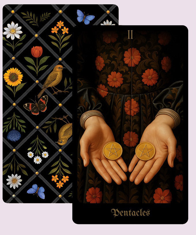 Secret Garden Tarot Two of Pentacles card depicting two pentacles held in open hands, set against a dark floral garment, shown beside the botanical card back.