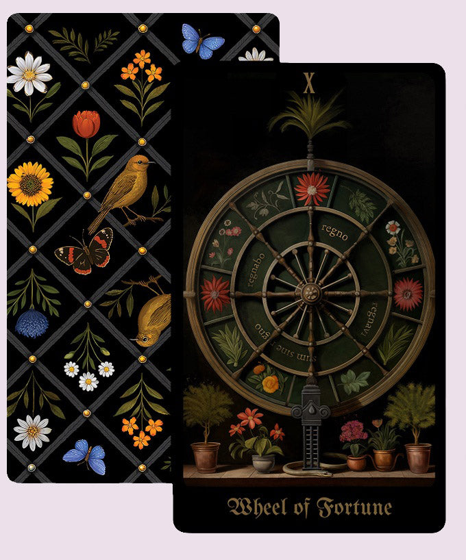 Secret Garden Tarot Wheel of Fortune card illustrated as a botanical wheel surrounded by plants, shown alongside the deck’s patterned card back.
