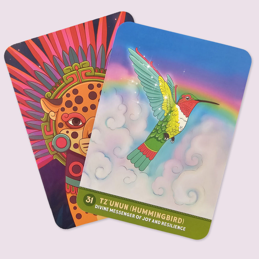 Tz'unun (Hummingbird), Divine Messenger of Joy and Resilience card from The Mayan Oracle featuring a radiant hummingbird flying through clouds beneath a rainbow.