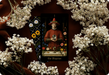 Secret Garden Tarot Magician card illustrated in a Renaissance-inspired style with botanical elements and symbolic tools.