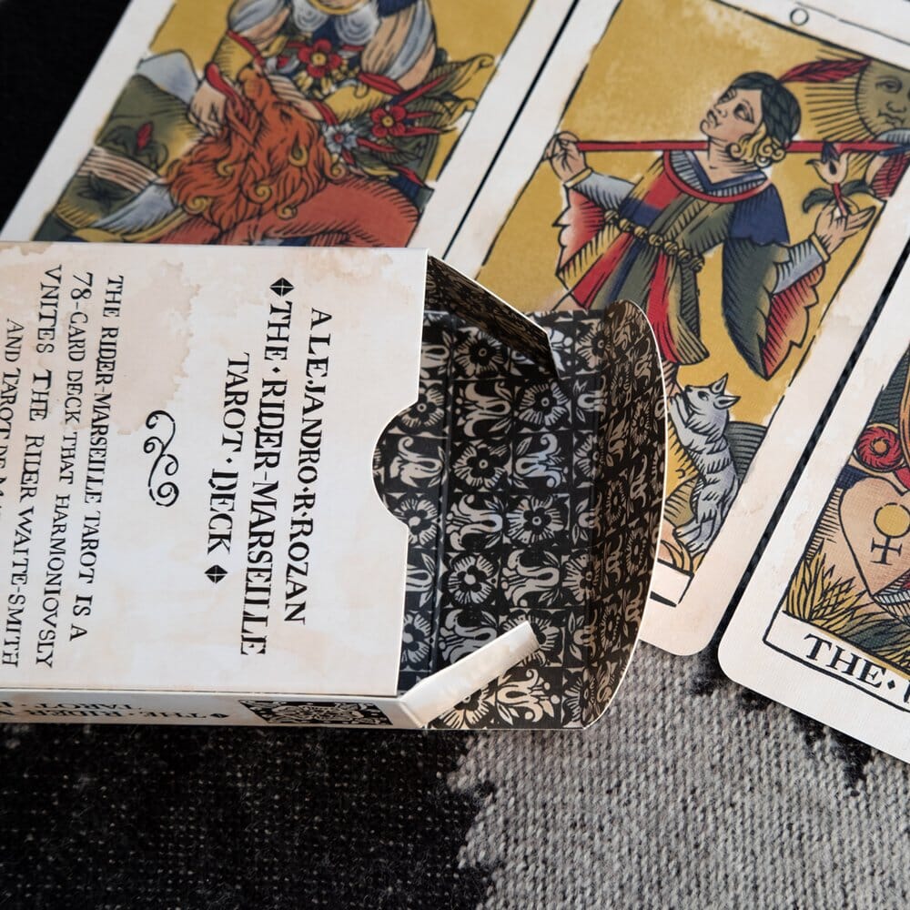 A close-up of a Marseille Tarot card, showcasing the suit symbols and traditional artwork style