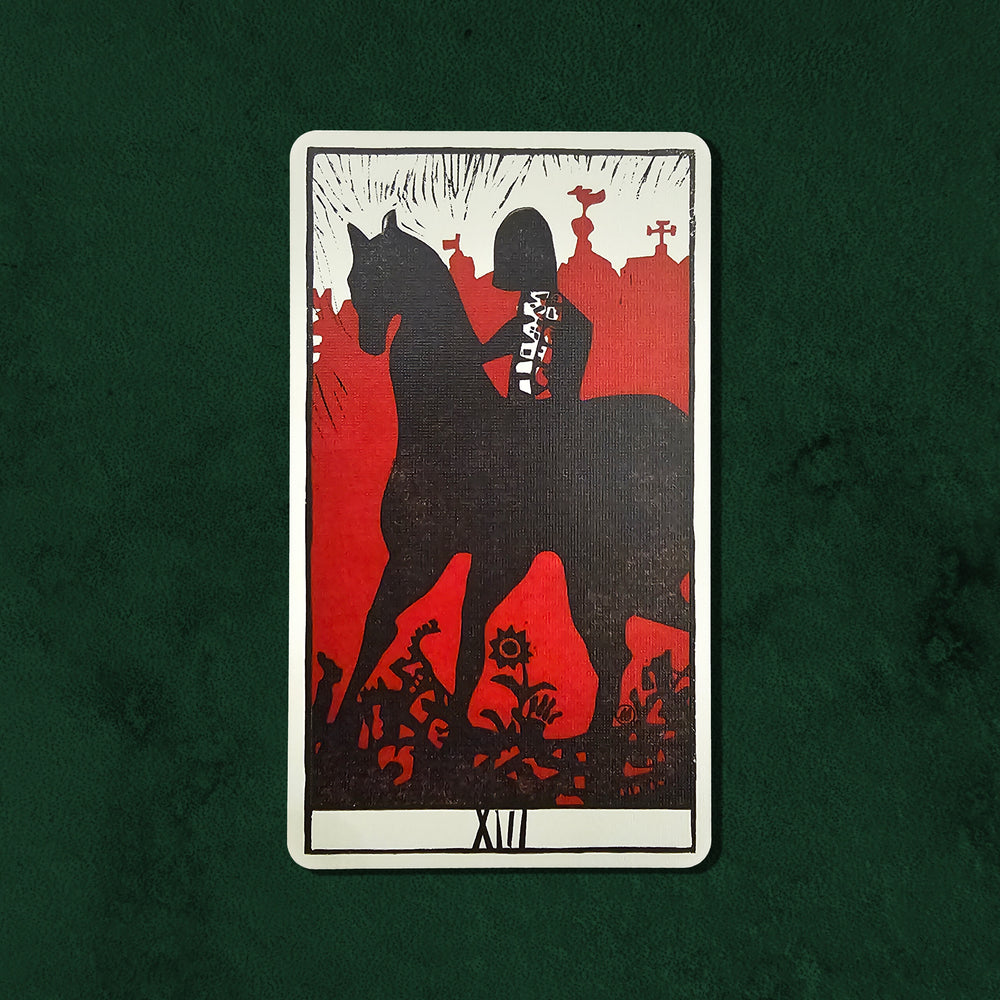Death (XIII) card from the Lux Tarot, featuring a silhouetted rider against a vivid red landscape that symbolizes transformation and renewal.